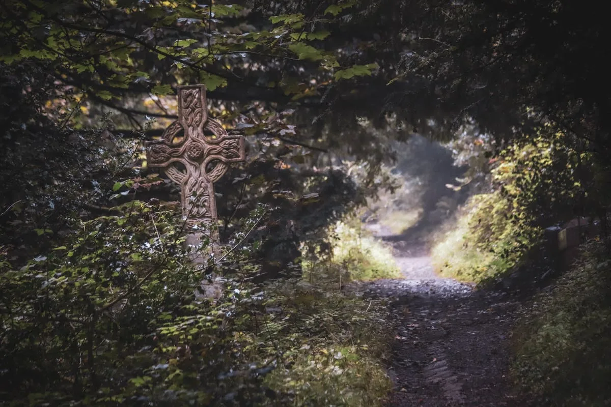 Celtic cross symbol in burnished gold, traditional Irish high cross with circle and knotwork