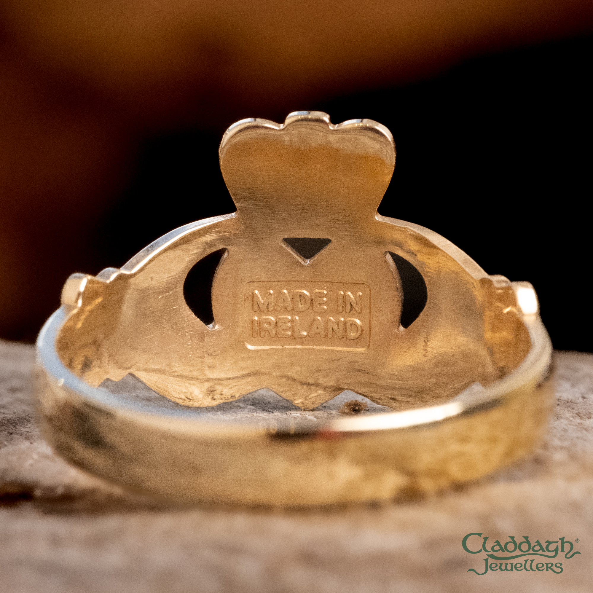 Close-up of Irish hallmark stamps inside a Claddagh ring band