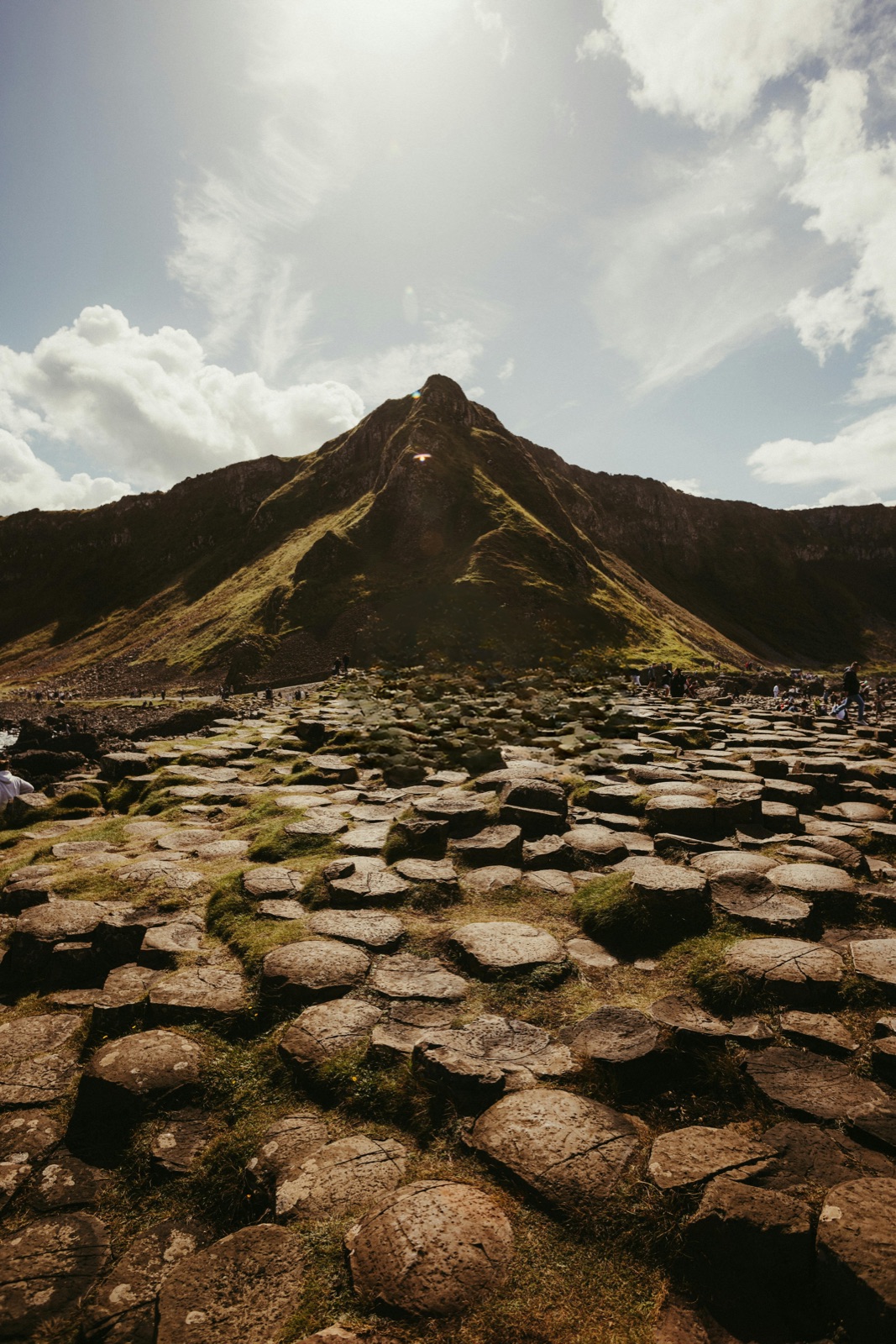 Giant's Causeway hexagonal basalt columns with Antrim headland in the background, County Antrim, Northern Ireland