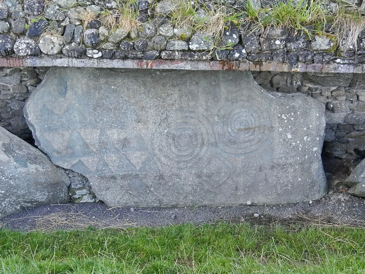Newgrange kerbstone carving, ancient Irish stone with spiral art related to the triskele symbol